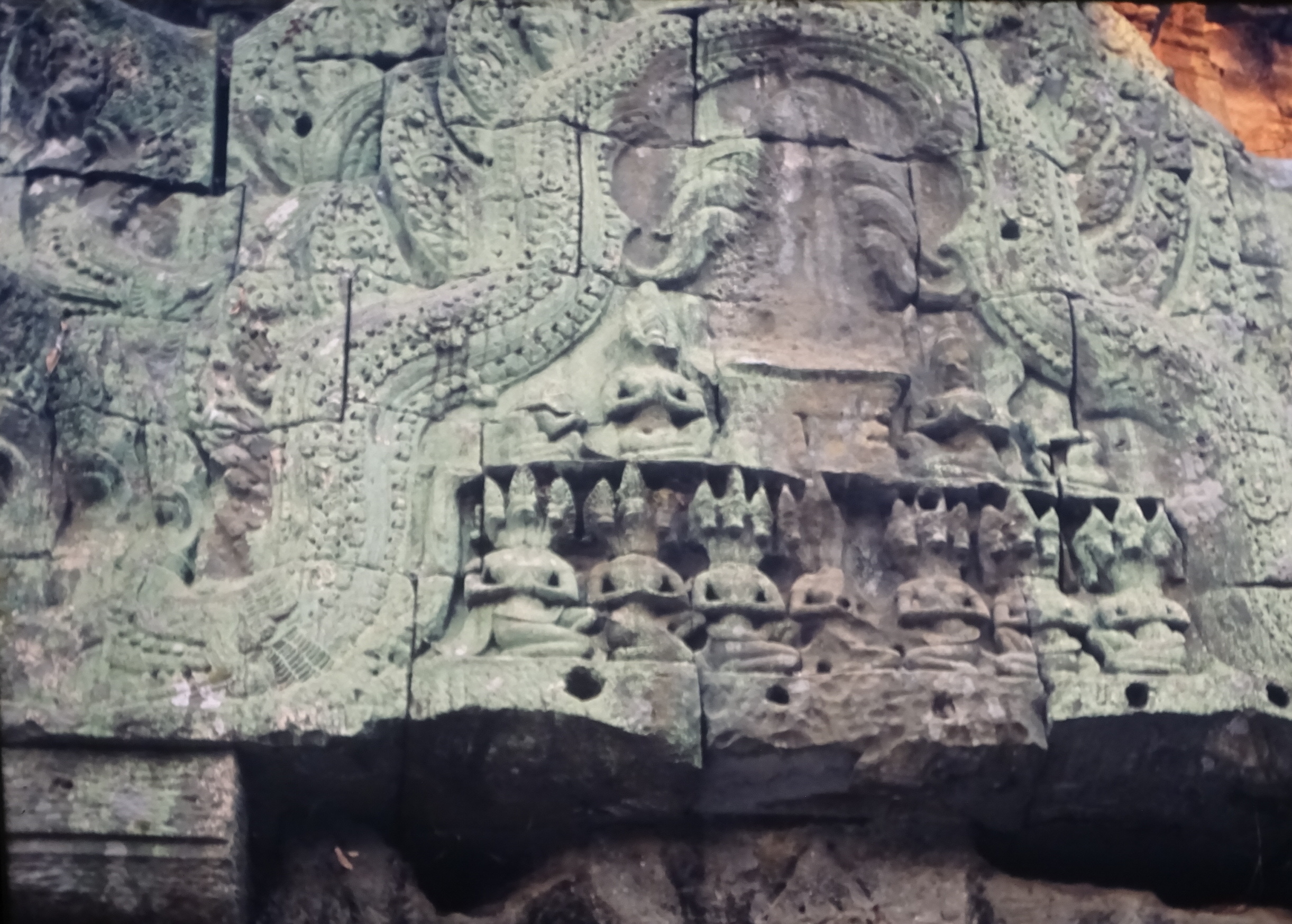 DSC04795 7.24 ta prohm pediment w 3-headed (horses?) squatting figs x 7