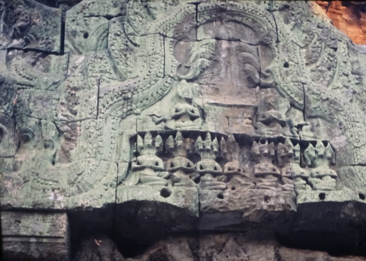 DSC04795 7.24 ta prohm pediment w 3-headed (horses?) squatting figs x 7